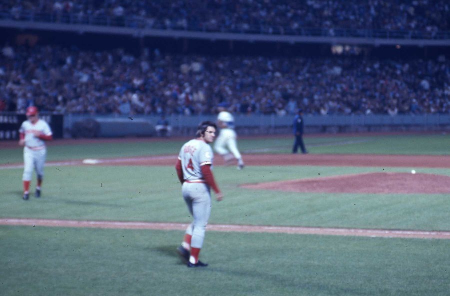 Pete rose walks onto the field.